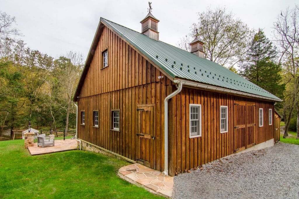 stone patio alongside barn