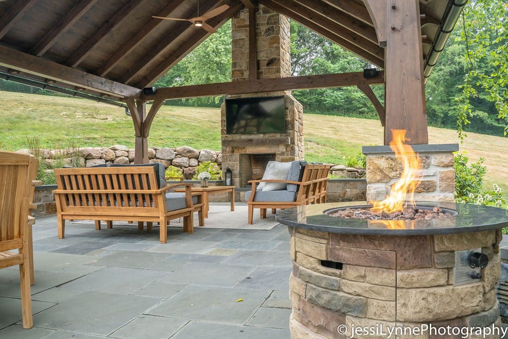 stone fireplace in an outdoor seating area