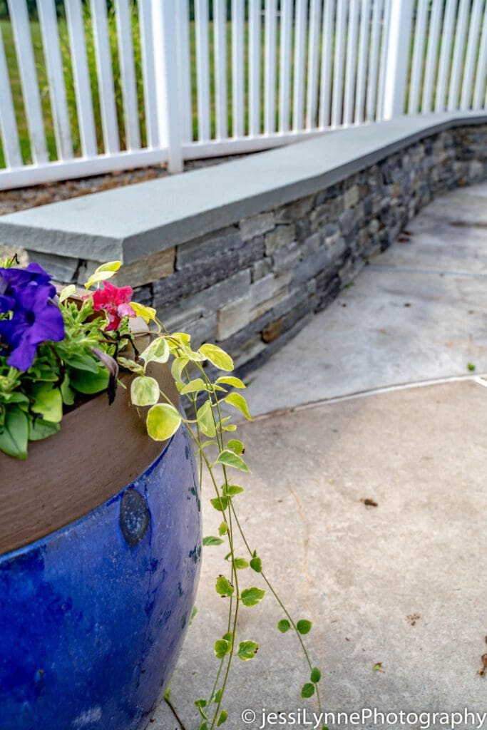 vinyl deck fence with stone wall