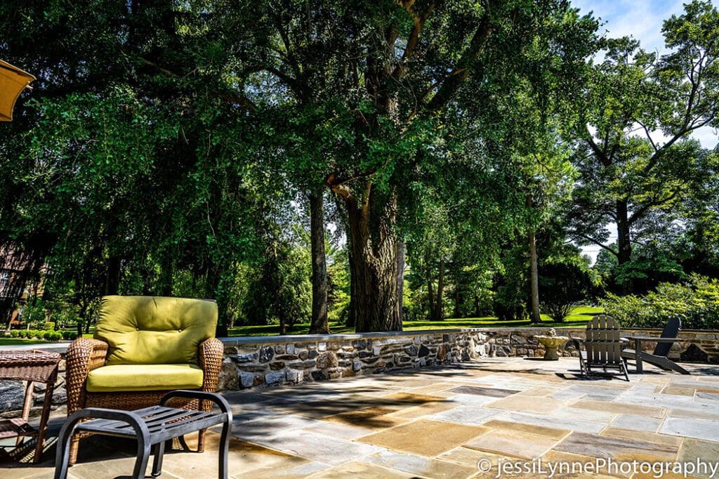 stone floored deck with stone wall