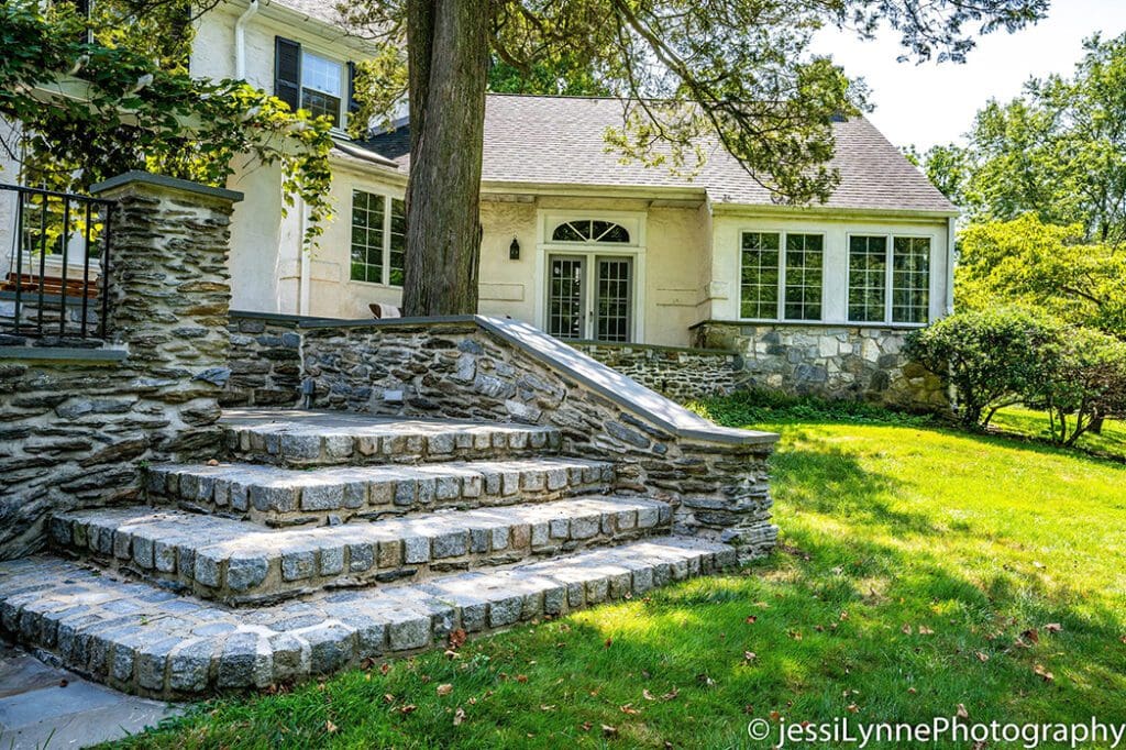 wide stone stairs outside a home