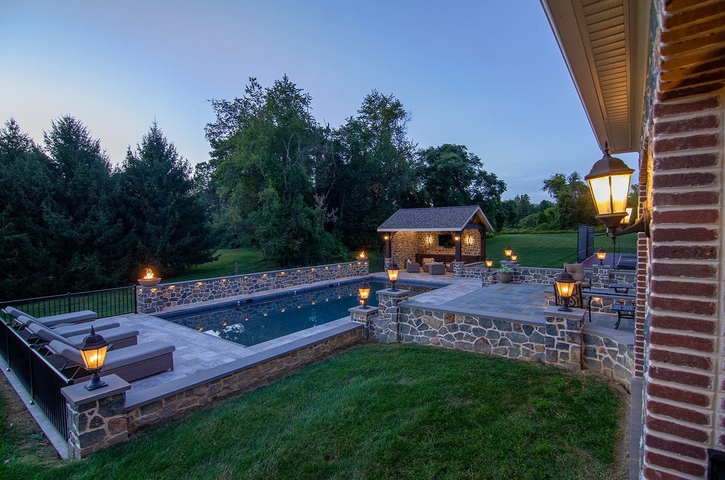 view of a stone pool border and patio