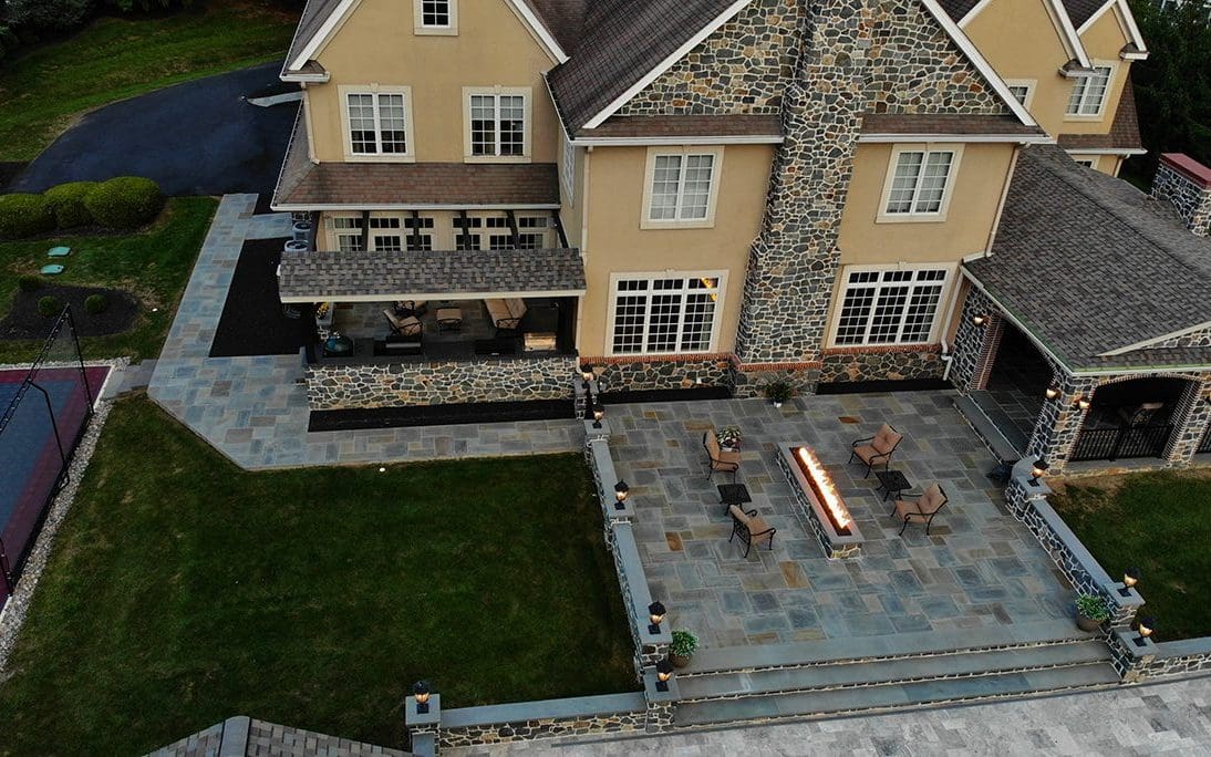 an aerial view of a stone patio
