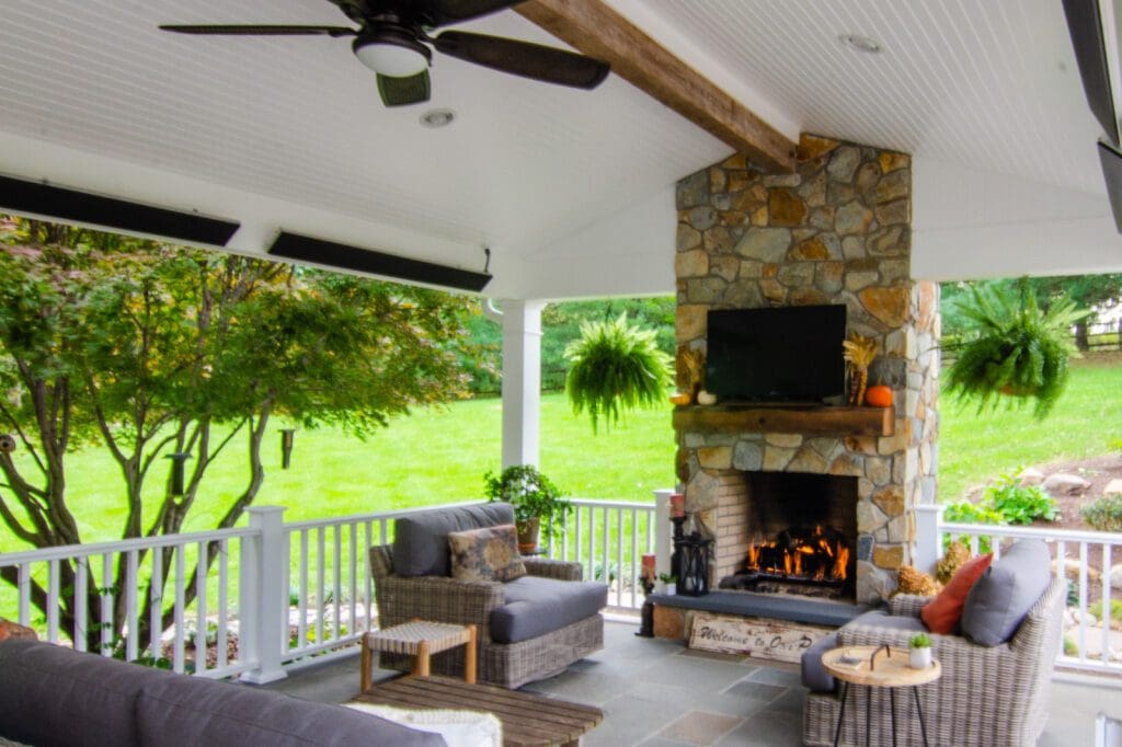 a stone patio with a fireplace