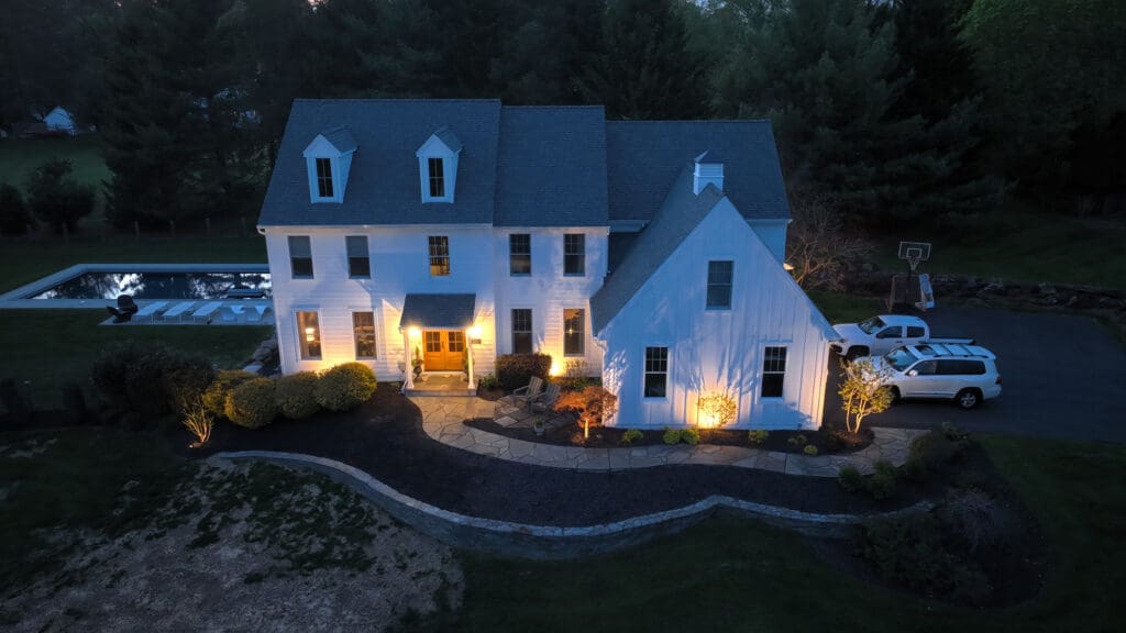 outdoor living project with luxury outdoor lighting fixtures from an aerial view